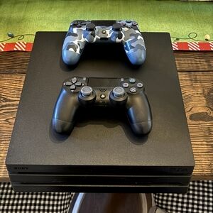 Sony PlayStation 4 Console with DualShock Controllers - Black and Camouflage